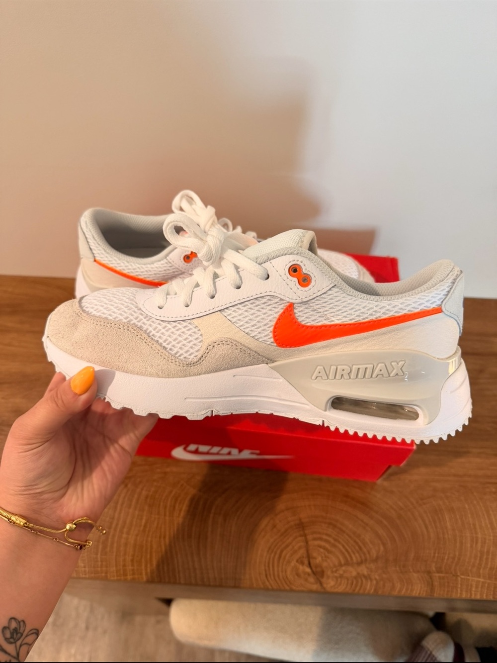 Nike Women’s Air Max Low-Top Sneakers in White and Orange